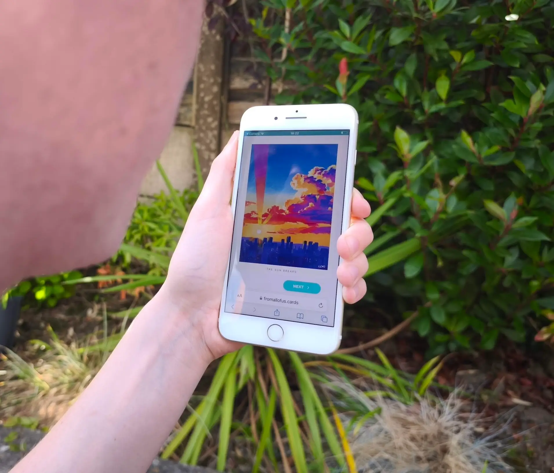 A person receiving an art card on their smartphone
